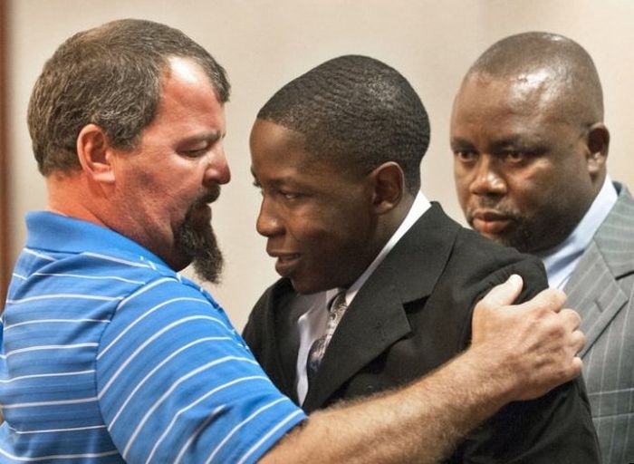The father of a car accident victim hugging the drunk-driving teen who caused the crash