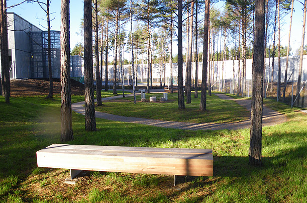 Haldens architects preserved trees across the 75-acre site to obscure the 20-ft.-high security wall that surrounds the perimeter, in order to minimize the institutional feel and, in the words of one architect, to "let the inmates see all of the seasons." Benches and stone chessboards dot this jogging trail.