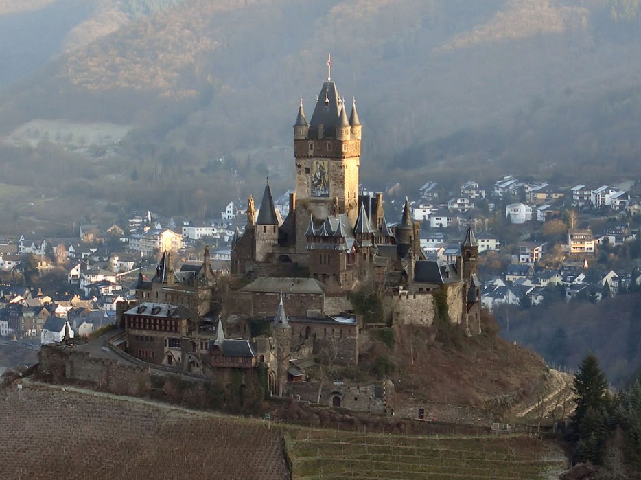 Reichsburg Cochem, Germany. Serving as a castle for King Konrad III of Germany and, after he captured it, King Louis XIV of France, this fortress was burned down by the French in 1689. A German businessman purchased the remains in 1868 and spent most of his wealth recreating the beauty of the original structure.