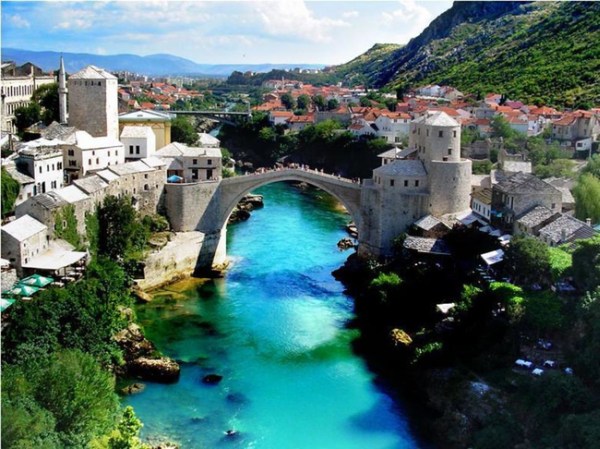 In Mostar, Bosnia, one can see the Stari Most, a bridge that spans over astonishingly beautiful blue water