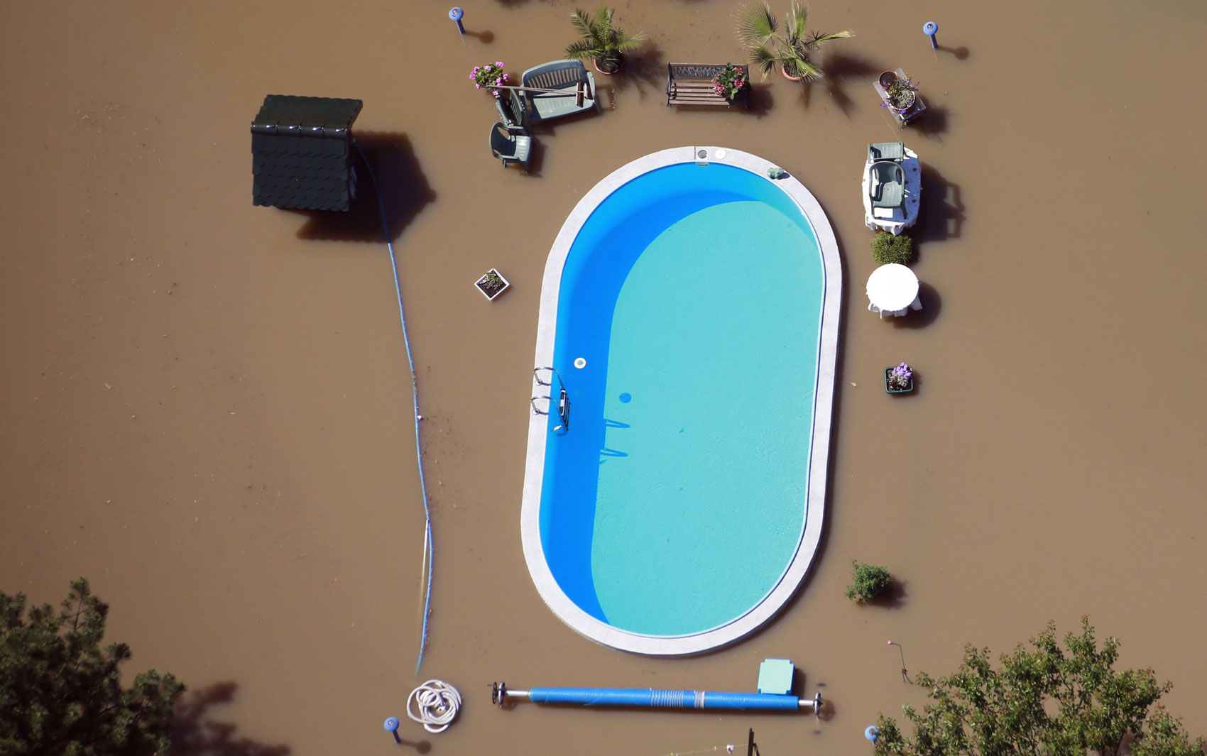 A pool during a flood that just narrowly avoids being contaminated.