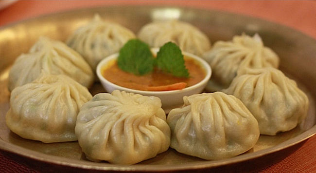 In Nepal...1 buys you 10 momo pork dumplings, served with sesame and chili garlic sauces.