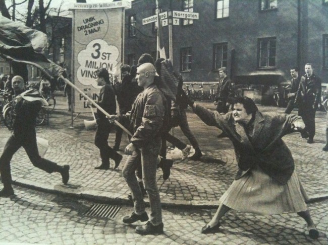 A Swedish woman hitting a neo-Nazi protester with her handbag. The woman was reportedly a concentration camp survivor. 1985