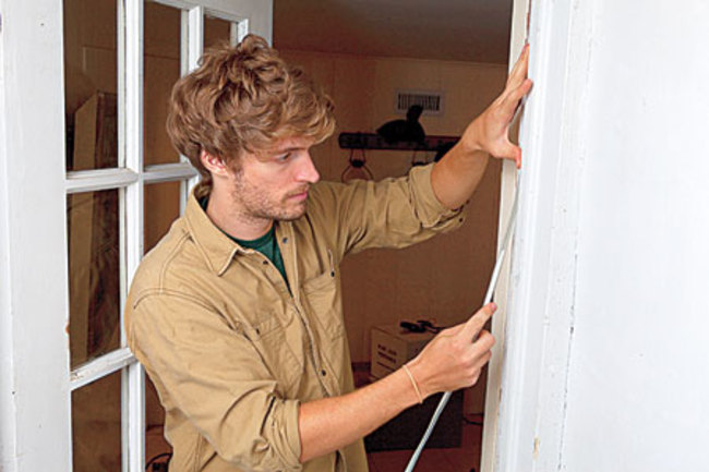 Use weather stripping to eliminate air leaks around door frames.Weather stripping is a cheap way to seal up the gaps around doors and windows through which precious heat loves to escape. Adding it can save you 10 to 15 percent on your energy bills.