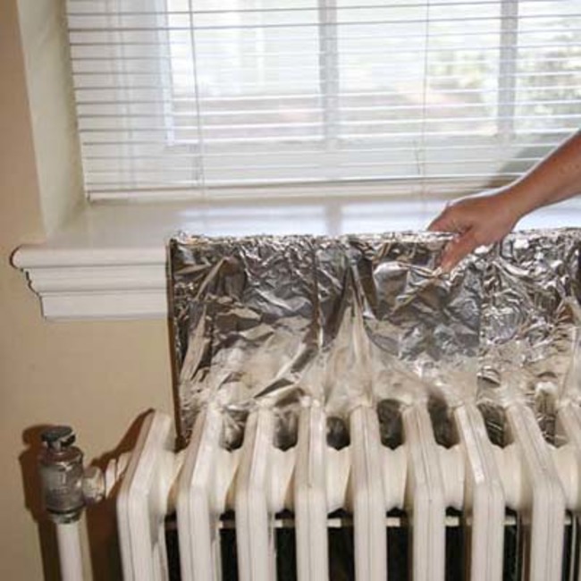 Add a panel of aluminum foil behind old radiators or wall mounted heaters. This hack uses high quality kitchen foil or, for a bit more, special radiator foil to reflect more heat back into the room rather than letting it escape through the walls.