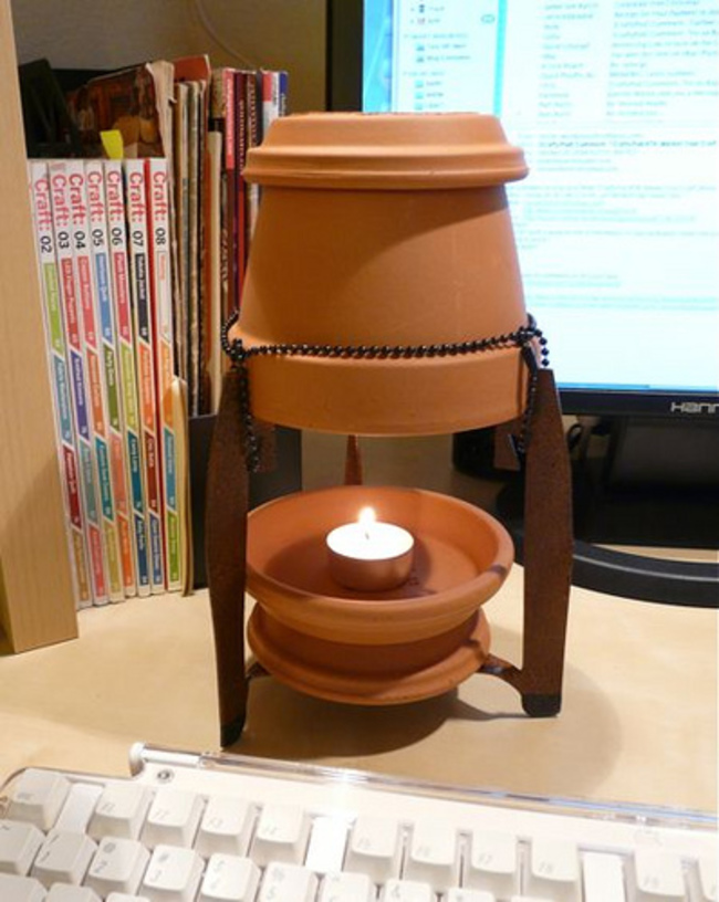 Make a Tea Candle Space Heater using a couple of ceramic flower pots and a tea candle, you can DIY a space heater that will keep a small room warm for about 12 cents a day.