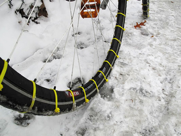 Give your bike some DIY snow tires.Attach zip ties between the spokes of your bike tires for improved traction.