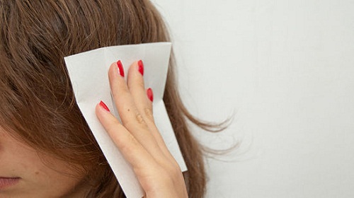 Use a dryer sheet to tame your staticky hair