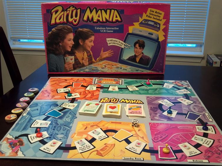 Party Mania:You've been invited to a totally awesome party, but you have chores to do before you get there. Move through the board and slowly get ready for the party by putting on makeup, doing your hair, etc. The best part about this game is that it's accompanied by a VHS, so characters such as Aunt Franny and Miss Dorothy Higginbottom can make this game feel interactive.