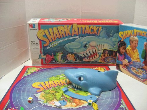 Shark Attack:It's a fast-paced game of chance! The perfect board game to play during Shark Week. You are a small fish moving around the board. If you're not fast enough, the motorized shark will ATTACK and swallow your fish! Last fish left in the "water" wins.