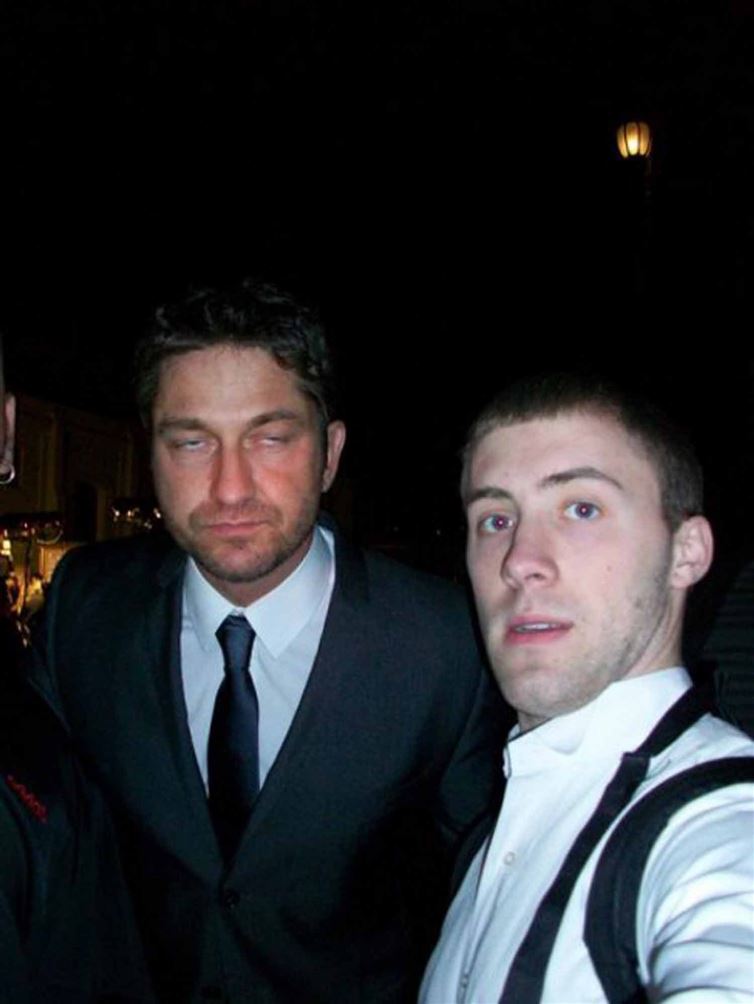 I hope that whoever the dude is in this selfie with Gerard Butler at least saw him into a cab.