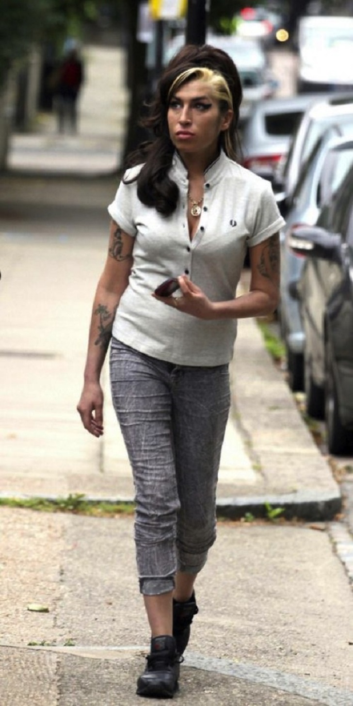 Amy Winehouse (September 14, 1983 – July 23, 2011) – Walking near her home in London about one week before her death. There is a lot of controversy surrounding her death. Some say it was due to alcohol poisoning, while others say it was due to her eating disorder.