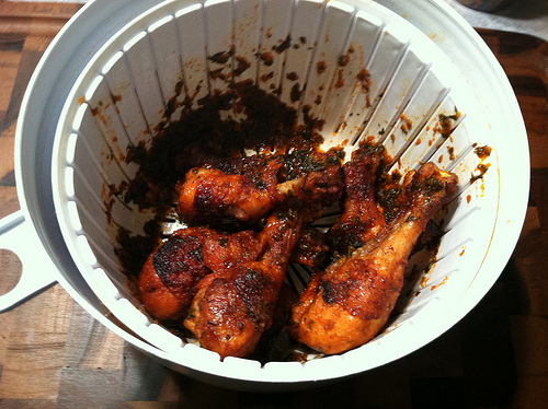 Use a salad spinner to evenly coat chicken wings.