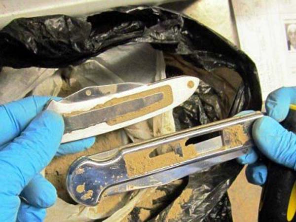 These two knives were found in a bag of dirt a passenger was carrying. No one knows why he had a bag of dirt.