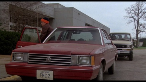 Brian’s license plate reads EMC 2â€³ and Andrew’s reads OHIOST. This is to go along with their nerd and jock appearances.
