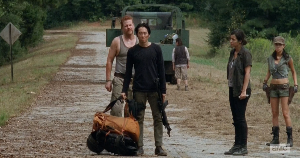 Glenn demands that Abraham stop the truck so he and Tara can get off. Glenn and Abraham get into a scuffle. We can see Eugene in the background standing next to the truck facing right of the camera. But when the camera cuts back to Eugene by himself, he’s now facing the opposite direction. Also the items in the back of the truck move from left to right.