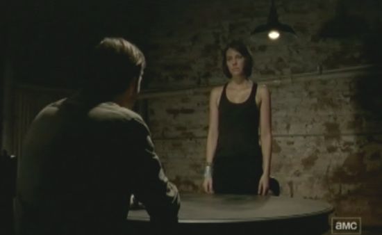 The first shot of Maggie waiting for the Governor to enter shows her wearing a black tank top with her shoulders bare. After he cuts the duct tape around her wrists, the camera pans up and she now has black bra straps showing on her shoulders.