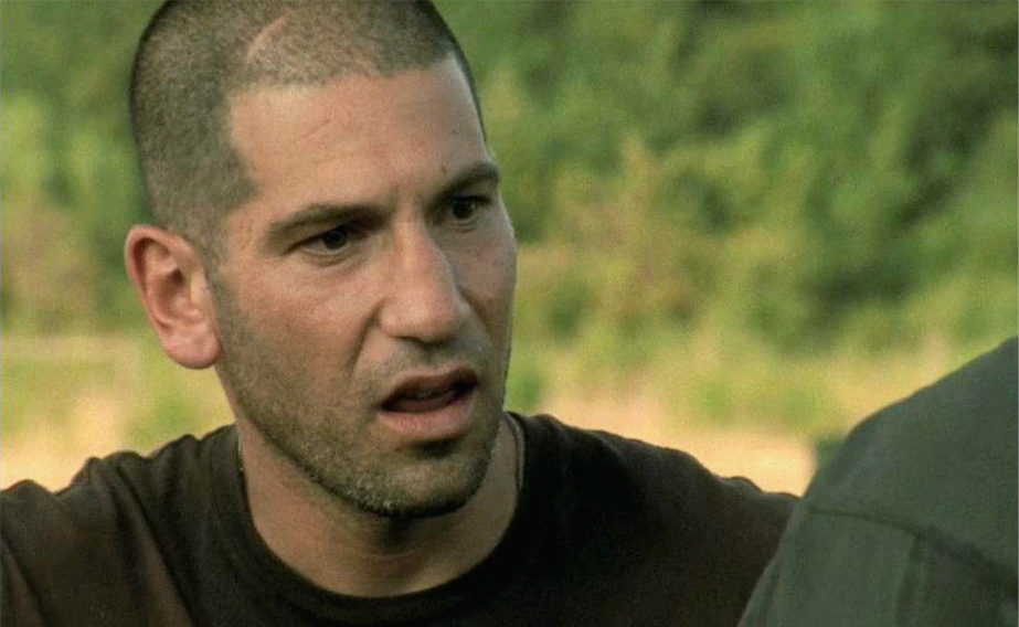 When Shane first sees  Dale in the swamp trying to hide the guns, Dale is holding a large spike to drive into the tree. In the next second, they show Dale standing next to the tree with the spike already in it.