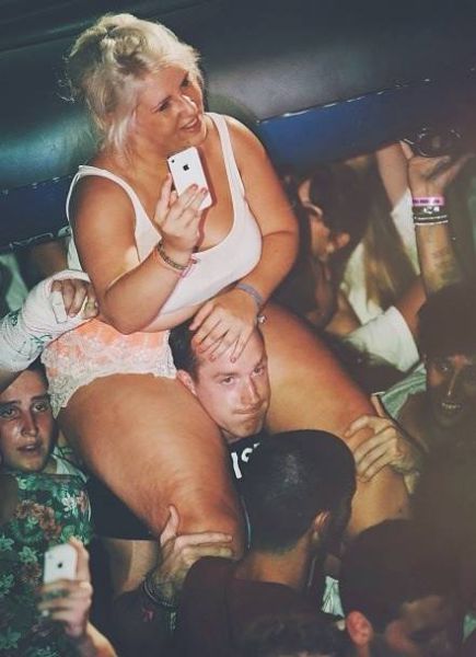 guy sitting on girl's shoulders