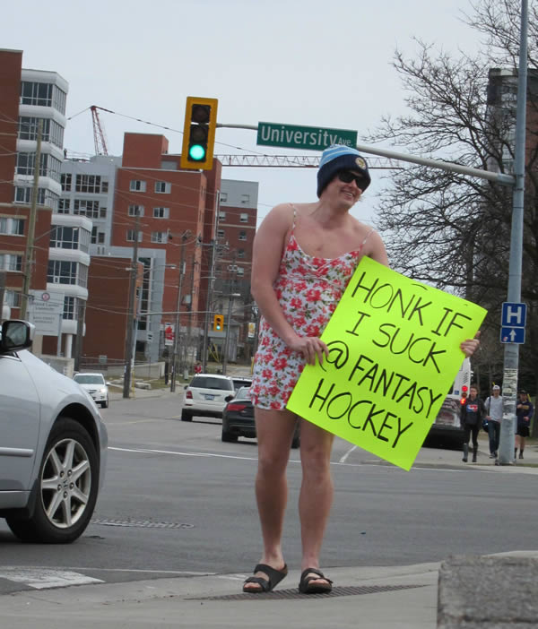 This guy lost in a fantasy hockey pool. He not only had to dress like this, he had to do so in one of the busiest intersections in Waterloo, Ontario right next to Wilfrid Laurier University.