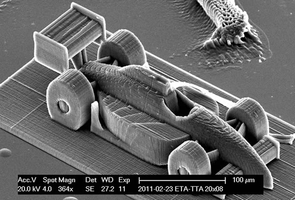 Smallest Race Car:
At just 100-micrometers wide, this microscopic race car, created by researchers at the Vienna University of Technology in 2012, was built "using a nanoscale 3D printer. Like a conventional 3D printer, resin is used to make shapes, but unlike a conventional 3D printer, the resin is hardened with a laser."