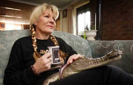 The woman who chose a pet crocodile over her husband:An Australian woman, Vicki Lowing, divorced her husband after he asked her to give up her pet crocodile, Johnie, which is "like a child" to her. Mrs Lowing, 52, who has hand-raised the one-and-a-half metre reptile for 13 years, gives it the run of the house and even lets it sleep with her son Andrew in his bed. Victoria adopted the crocodile after it was left on her doorstep in 1996 by an anonymous person. Her husband Greg said she spent too much time with the pet and asked her to give it up in a bid to save their marriage, but she refused and the couple divorced in 2005.