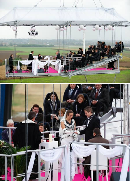 The couple who got married on a Bung-jump platform – and obviously jumped after saying yes:  
Jeroen and Sandra Kippers of Brussels, Belgium, were lifted on a platform by crane up 160 feet in the air for their wedding ceremony. They were joined by the officiant and about 20 guests. Another platform held the musicians. After the vows, they made it official by bungee-jumping over the side!