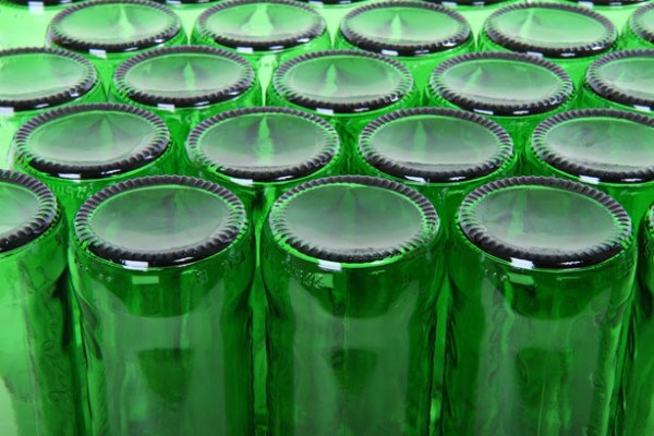 The bumps on the bottom of beer bottles are there for a reason.
They provide friction when the bottles travel on conveyor belts.