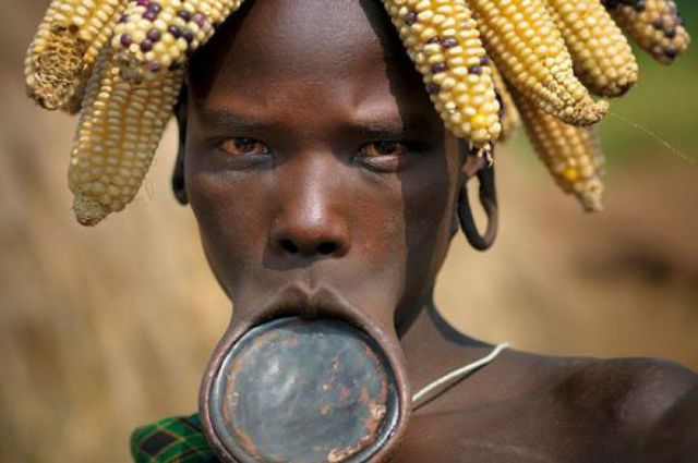 Mursi woman with lip plate in Ethiopia.