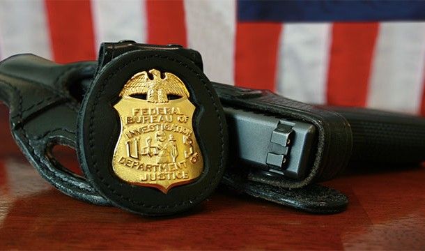 fbi badge and gun - Federal Speau Of Ustice