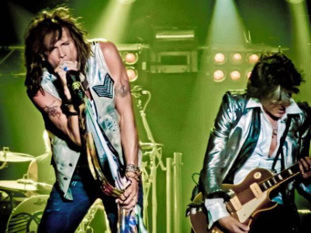 Guns N’ Roses toured as Aerosmith’s opening act in the summer of 1988. It was a thrill for the band, since they all idolized Aerosmith and particularly Steven Tyler, and the two bands got along great. At first, a system was put in place to keep the bands separated, since Aerosmith had been through rehab and their management didn’t want them around drugs and alcohol. As the tour progressed, a mentor relationship formed between the bands, as Aerosmith saw their younger selves in Guns N’ Roses.