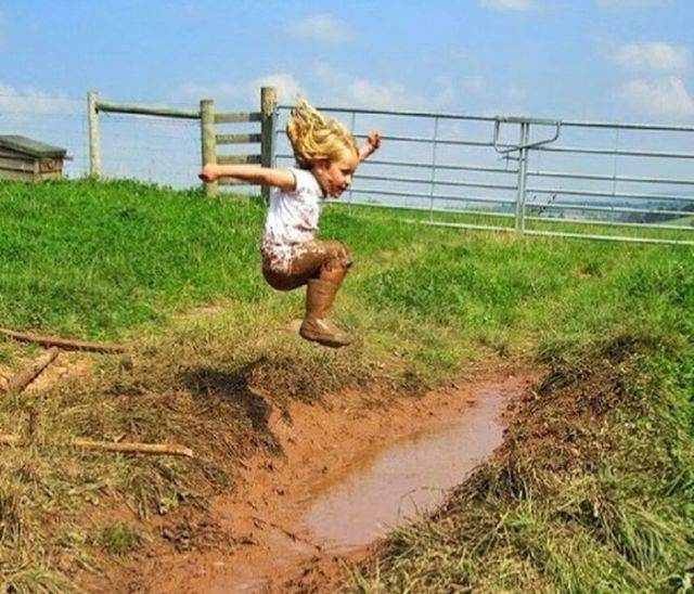 farm kids playing in mud