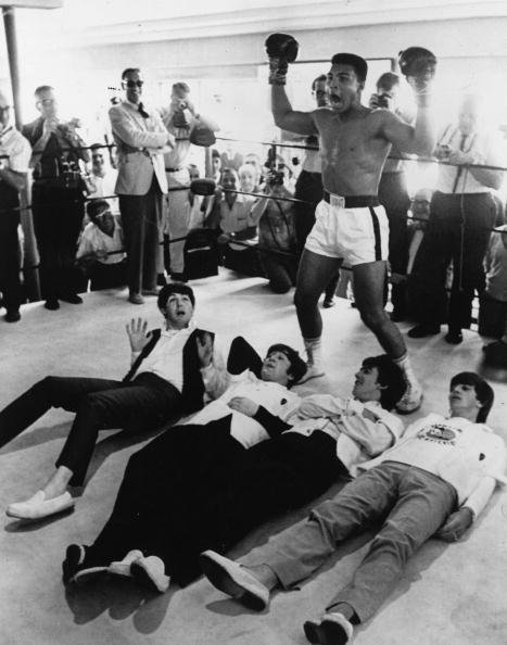 Muhammad Ali poses in the ring in mock victory over The Beatles, 1964.