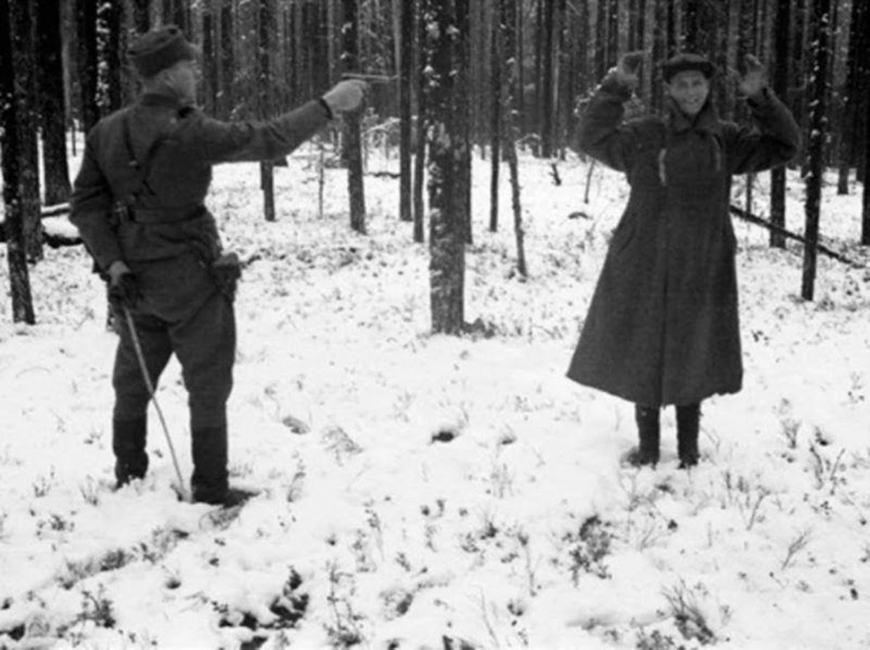 A Russian spy is laughing through his execution in Finland in 1939 during the Winter War.