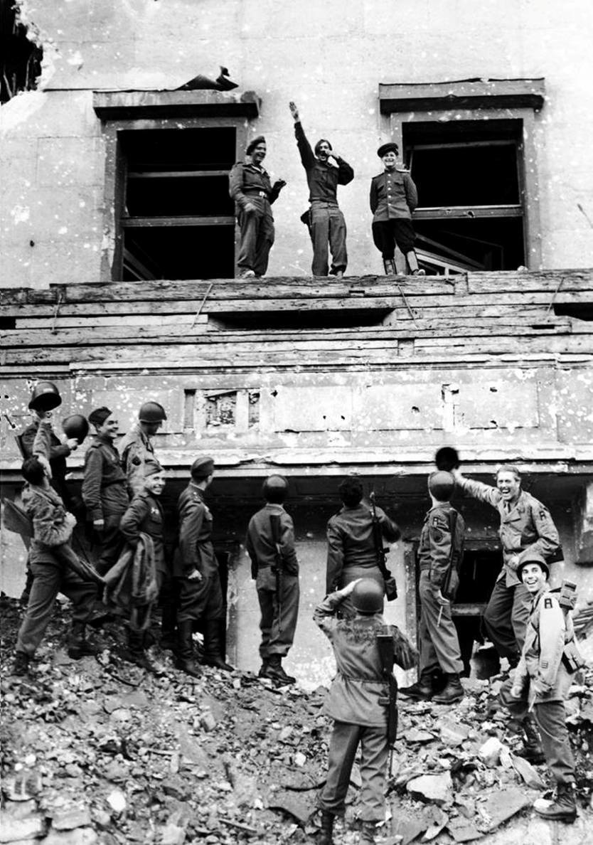 Allied forces mock Hitler from atop his balcony at the Reich Chancellery at the end of WWII.