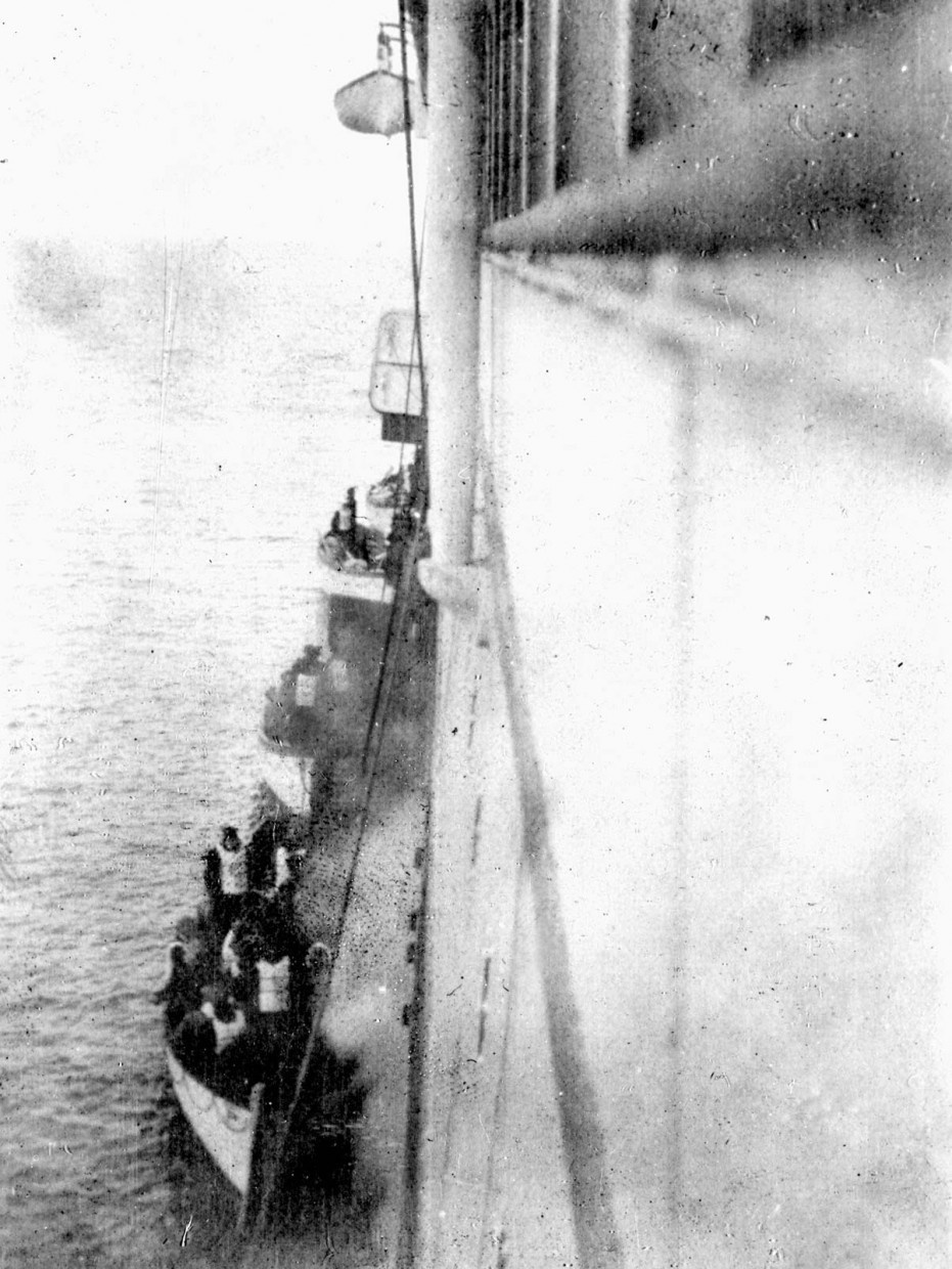 Titanic survivors boarding the Carpathia in 1912.