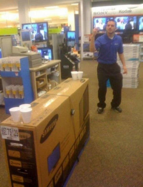 work meme with an electronics store worker playing beer pong