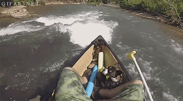 Man's dog goes overboard and he just picks him up and puts him back in the kayak.