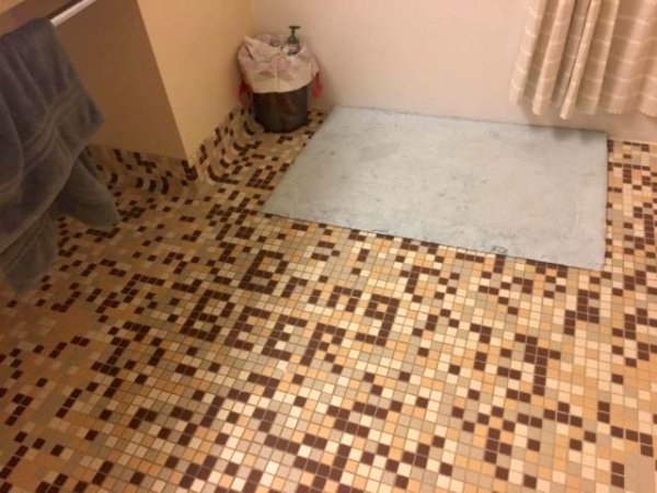 Bathroom tiles that read Bring BEER