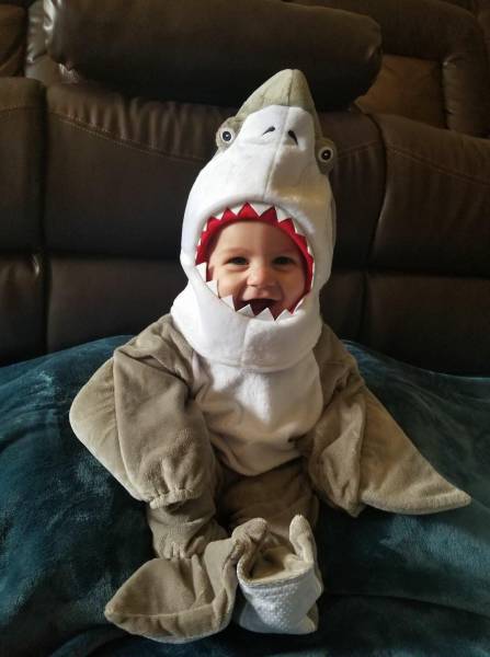 Kid dressed up in Shark pyjamas
