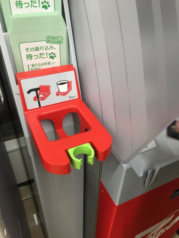 Cane holder at ATM for the aging population.
