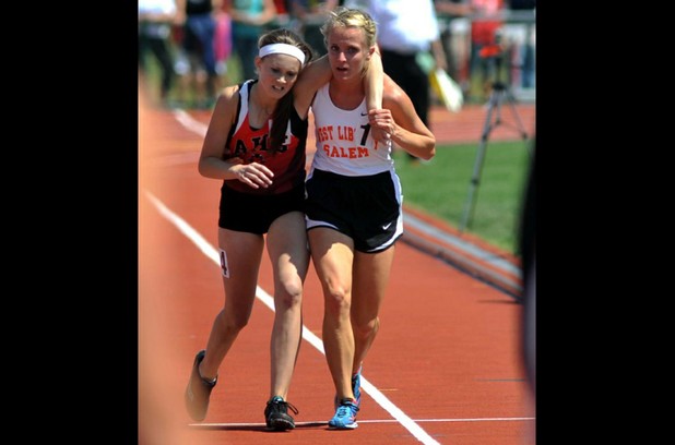 17-year-old Meghan Vogel helping her competitor to cross the finish line