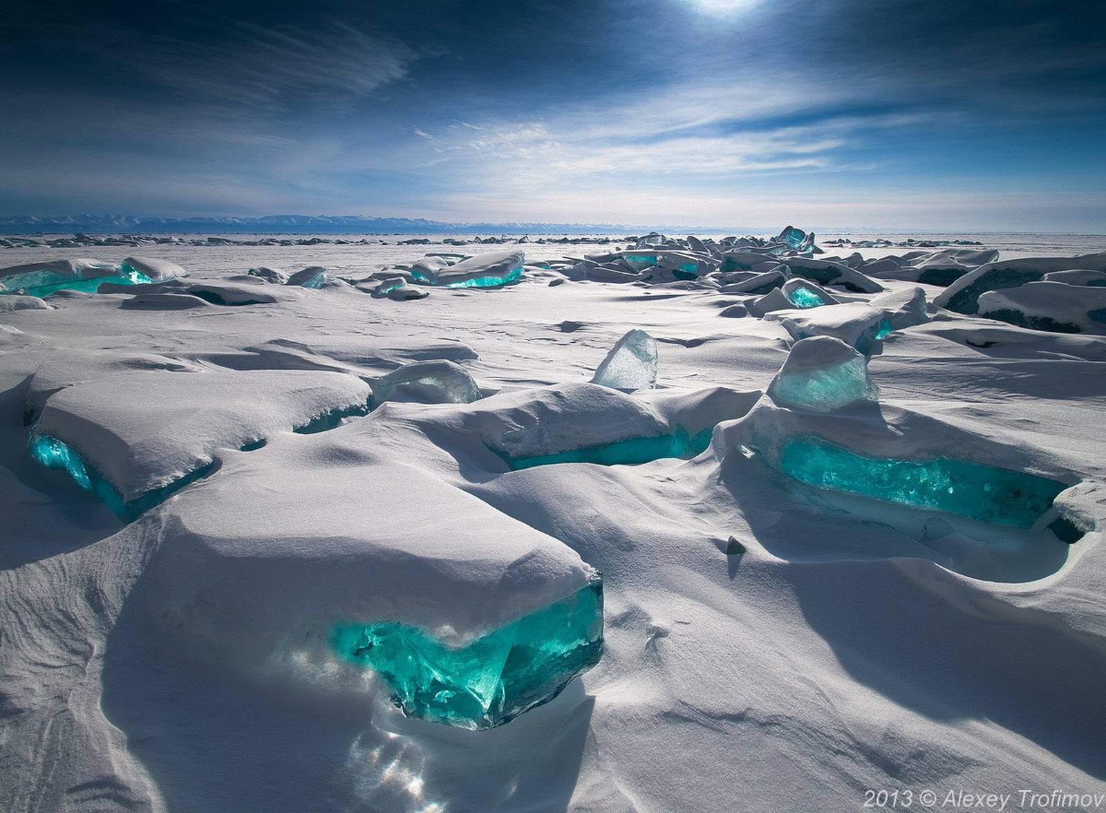 southern Russian region of Siberia. Lake Baikal is one of the worlds largest and oldest freshwater lakes.Where turquoise shards sit on top creating a beautiful spectacle