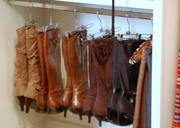 Use clothing hangers to organize your boots