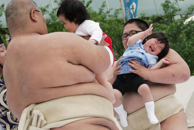 In Japan, letting a sumo wrestler make your baby cry is considered good luck