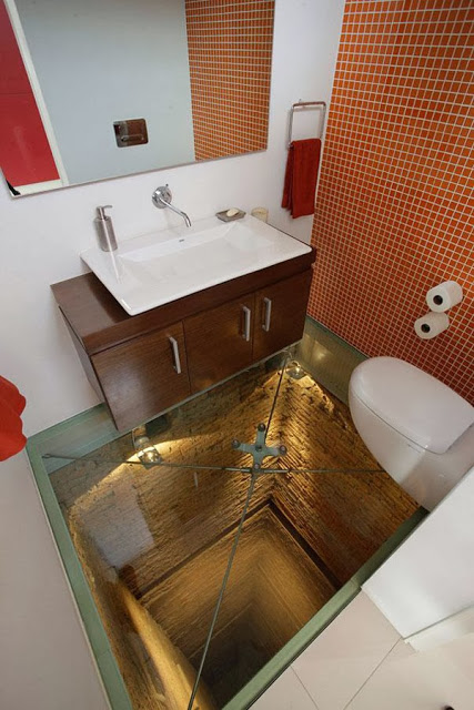 21. A bathroom floor above an abyss