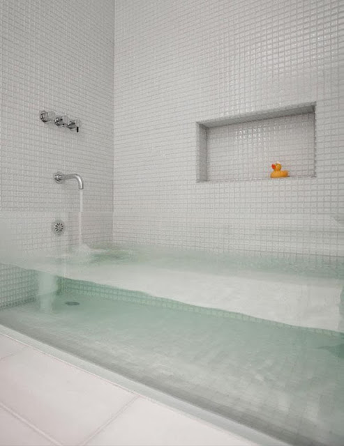 23. This see-through bath tub for all of your bubble bath needs