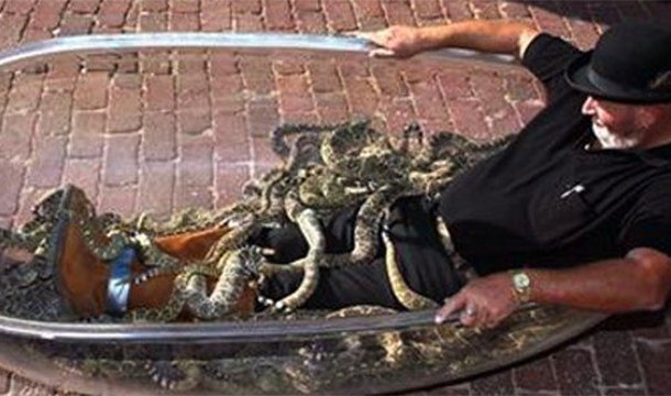 jackie Bibby, aka The Texas Snake Man sat in a tub with 87 snakes for 45 minutes