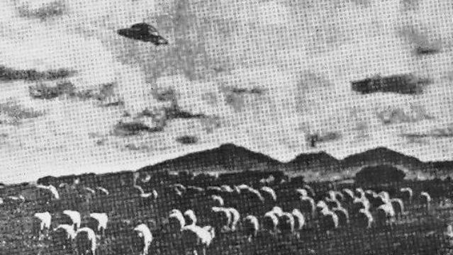 Australia -Taken in 1954 by a sheep farmer named W.C. Hall, this photograph clearly shows a round unidentified flying object with top and antenna in Australia. Actually, there was more than one UFO spotted above the mountain near his place. The photo was later published in a local newspaper.