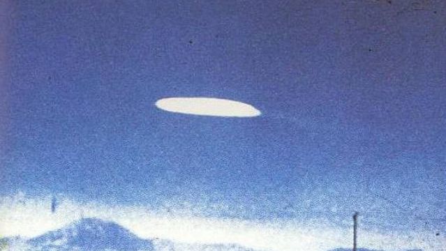 Holloman Air Force Base, New Mexico -This photo was taken on October 16, 1957 by Ella Louise Fortune while she was driving along Highway 54 at 1:30 in the afternoon. According to her, the UFO that she spotted was motionless over Holloman AFB.